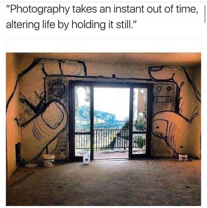 camera window art - "Photography takes an instant out of time, altering life by holding it still."