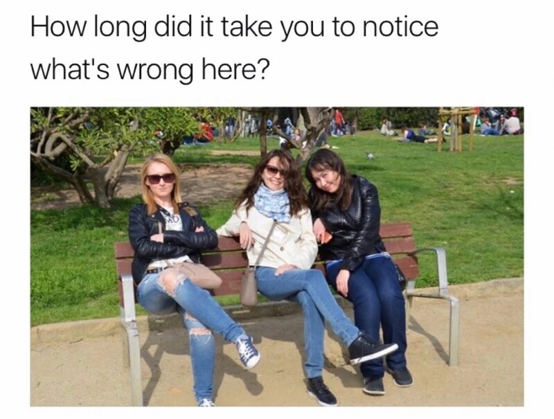 girls on a bench - How long did it take you to notice what's wrong here?