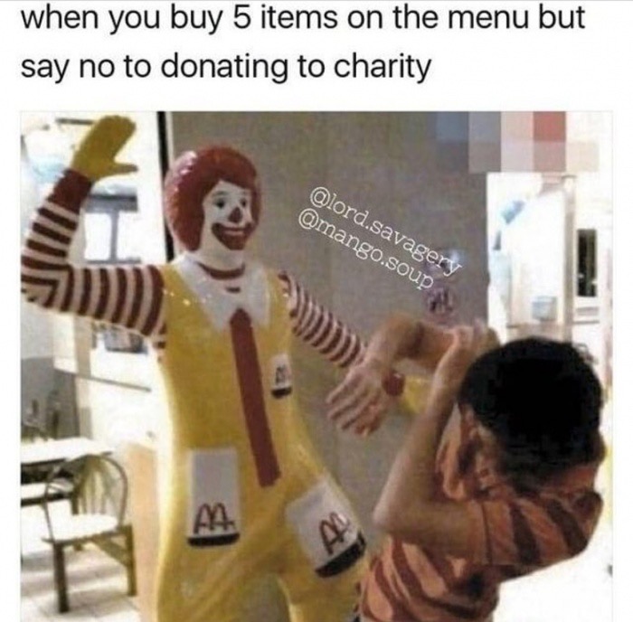 Meme of someone posing as if being hit in front of Ronald McDonald statue figure, with caption about buying on menu but not donating to charity.