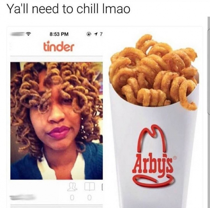 Tinder profile pic in which a woman's curls look like some kind of onion rings.