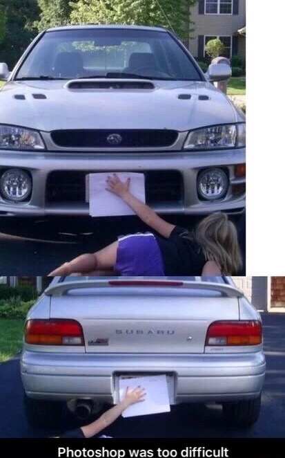 Picture of a car in which a woman is manually holding up a piece of paper to block the license plate.