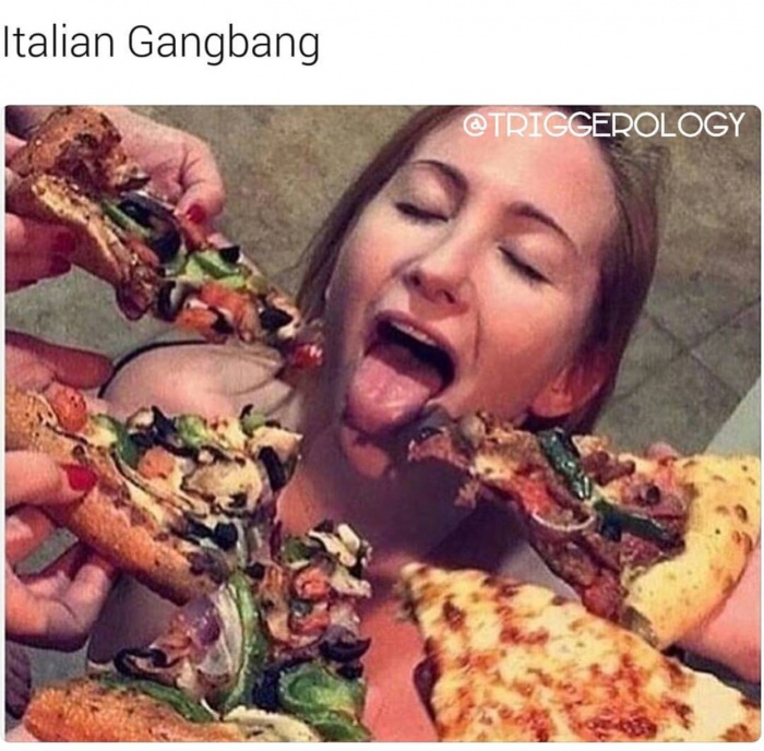 Picture of a girl with her mouth wide open and a bunch of guys sticking their pizza in her face.