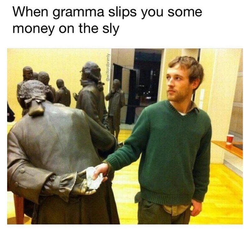 Man posing with a statue as if grandma is slipping you some money.