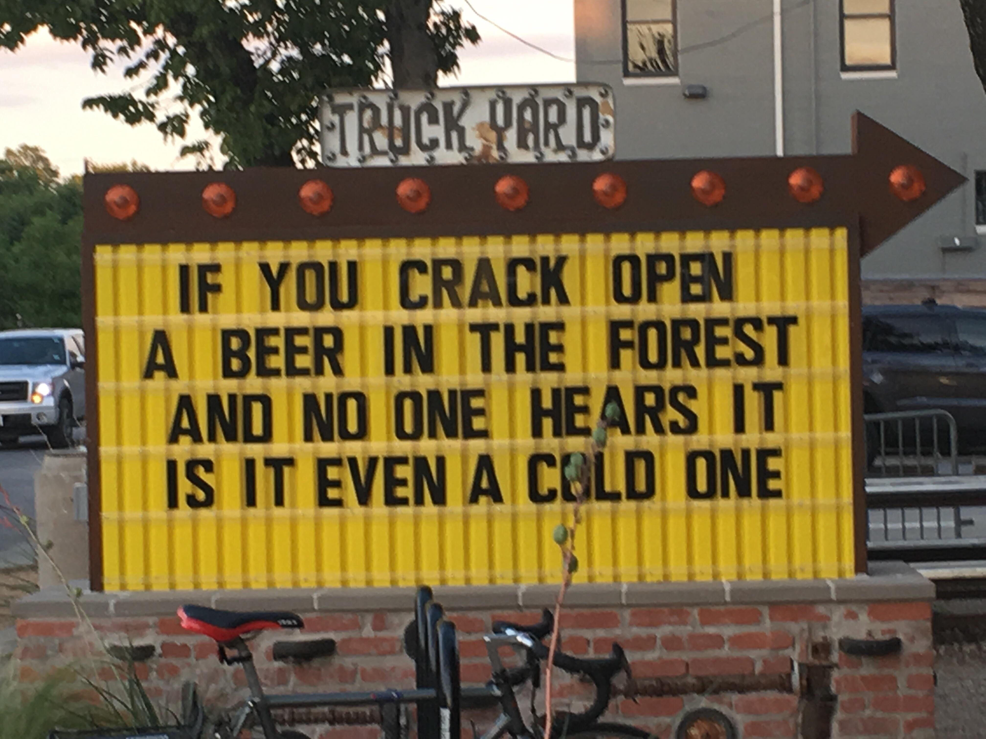 Funny sign asking if you crack open a beer in the forest and no one hears it is it even a cold one?