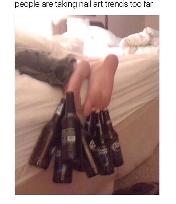 Pic of someone wearing beer bottles on their toes and caption saying this nail art thing is going to far.