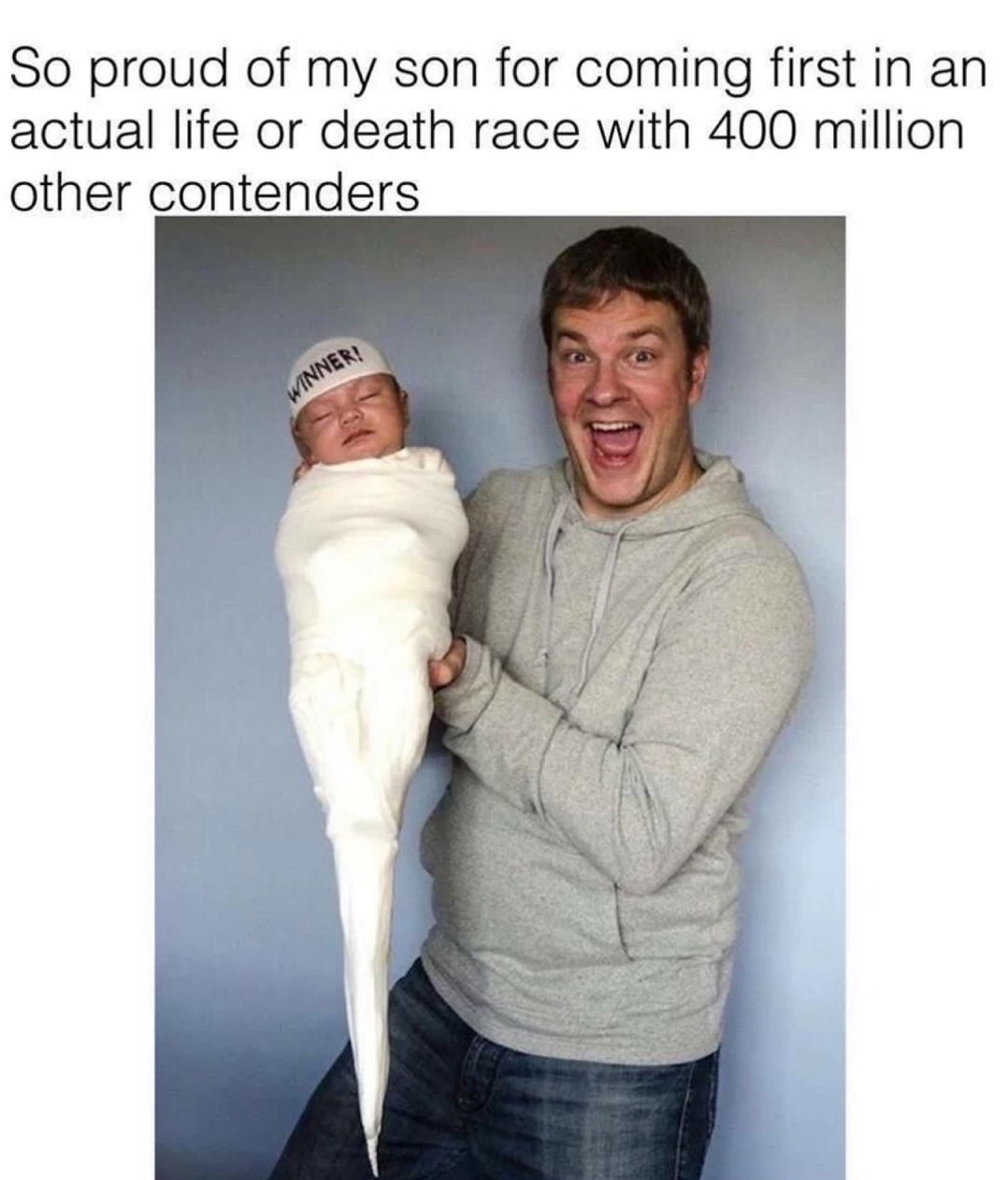man congratulating his child for winning a life or death race with 400 million other contenders.