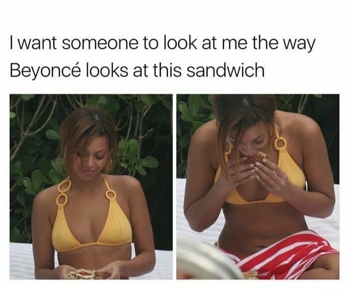 Beyonce looking at her sandwich with love