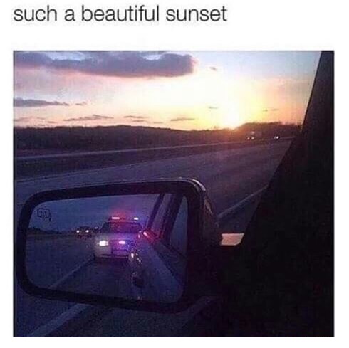 Pic of a beautiful sunset and cop in the side mirror
