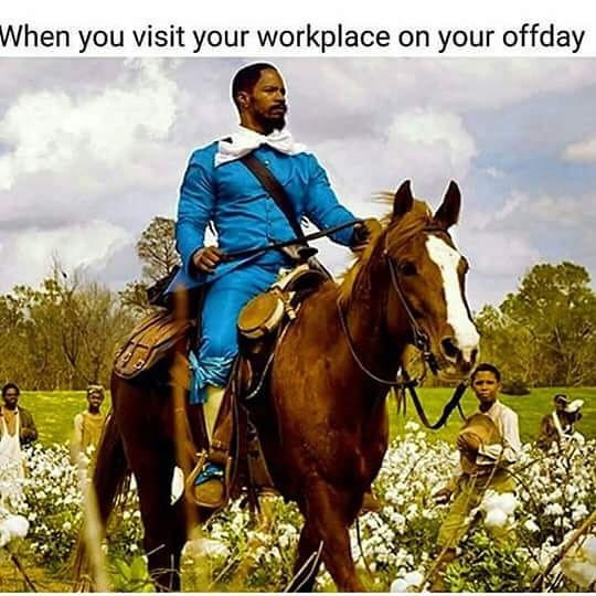 Django (Jamie Fox) dressed in blue on his horse riding by the slaves as how it feels visiting work on your day off.