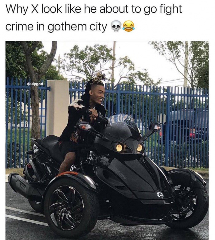 X on a bike that makes him look like he might be Batman.