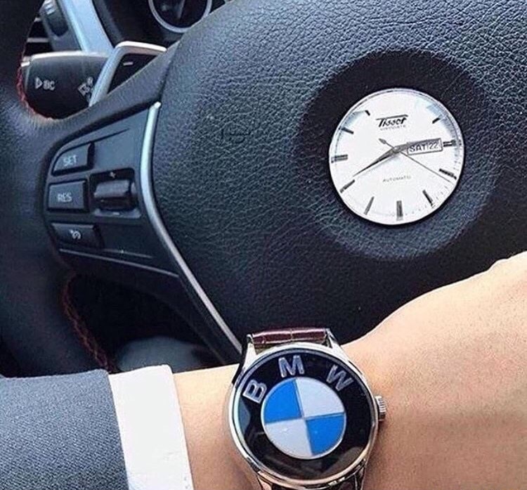 Man with BMW logo for a watch and a watch where the logo goes.