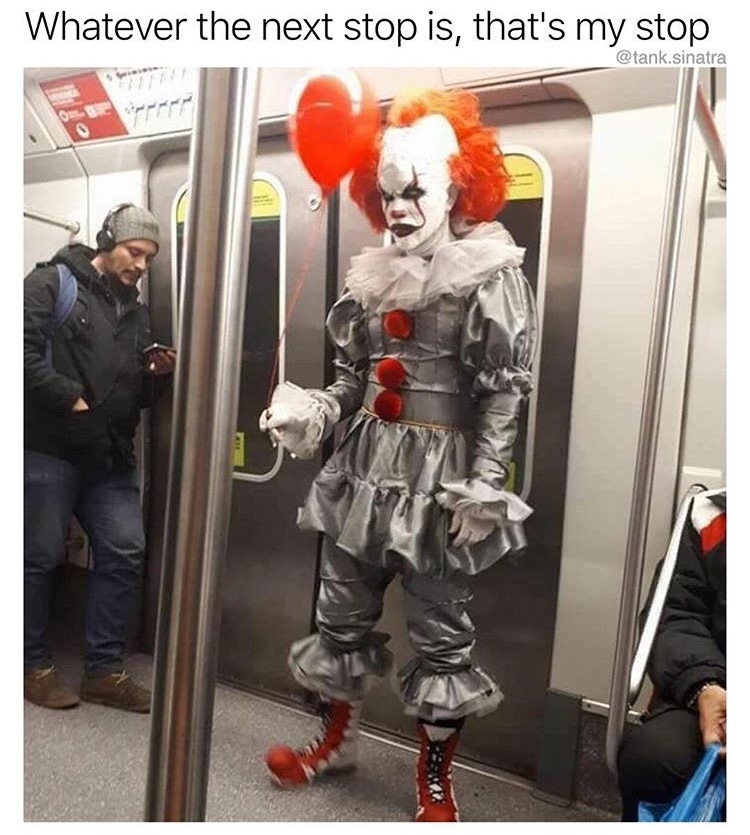 Scary clown on the subway with a lone red balloon