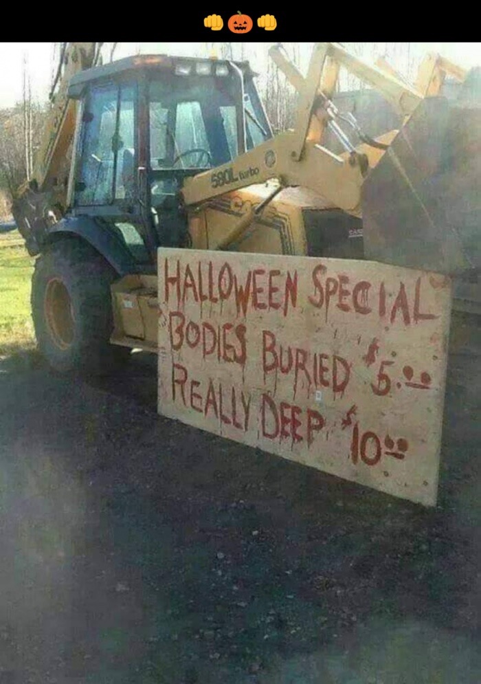 Backhoe with funny sign for Holloween