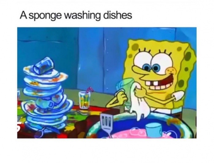 A sponge washing dishes