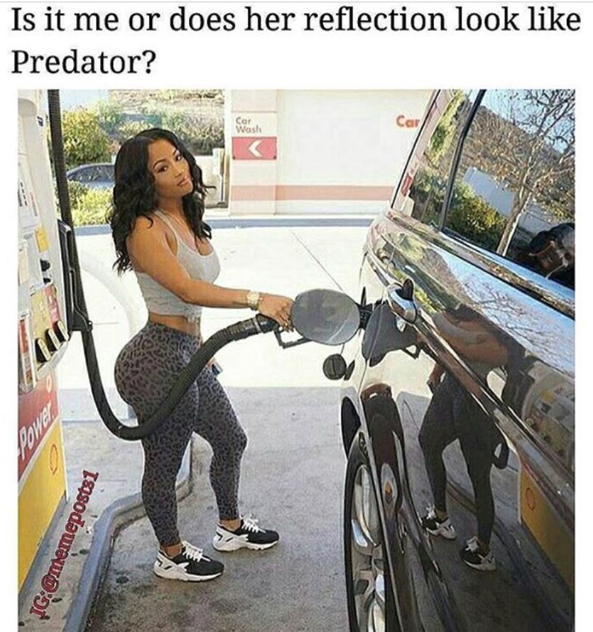 hot girl pumping gas and her reflection looks like the predator