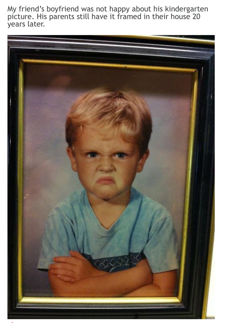 Woman posts picture of a portrait of her boyfriend when he was a small child in which he was not happy about having his photo taken, with adorable frown and crossed arms
