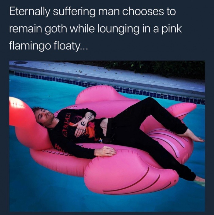 arm - Eternally suffering man chooses to remain goth while lounging in a pink flamingo floaty...