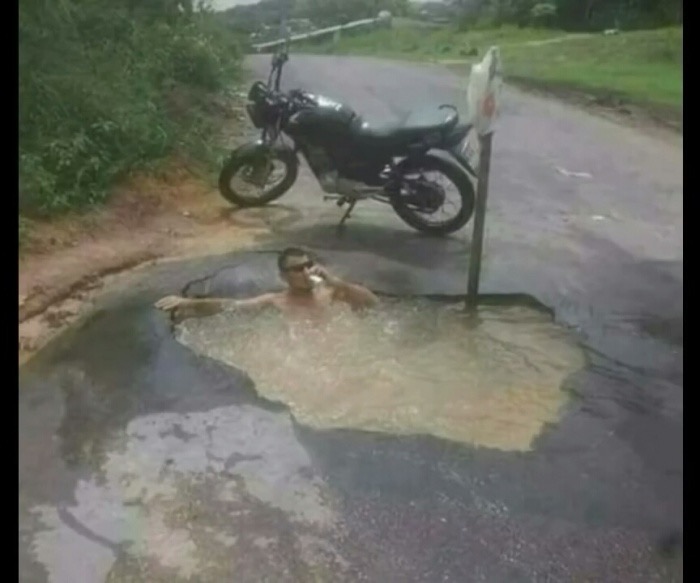 biker cooling off in puddle dank meme