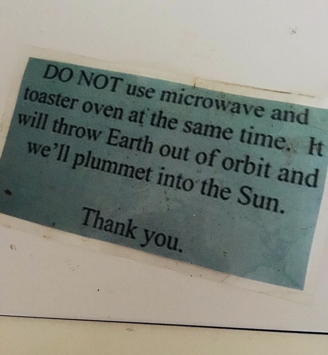commemorative plaque - Do Not use microwave and toaster oven at the same time. It will throw Earth out of orbit and we'll plummet into the Sun. Thank you.