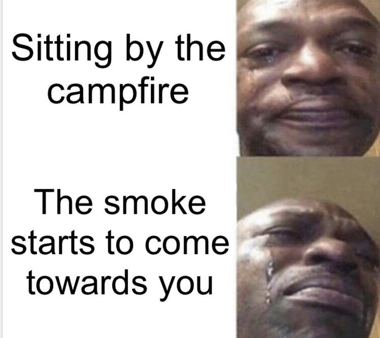 photo caption - Sitting by the campfire The smoke starts to come towards you