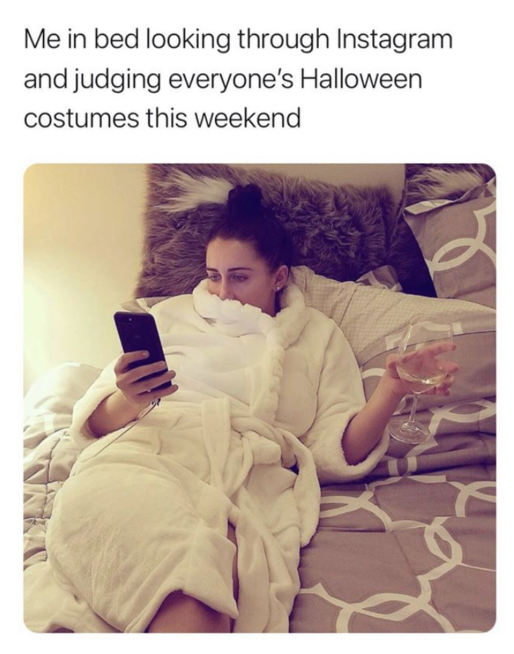 sitting - Me in bed looking through Instagram and judging everyone's Halloween costumes this weekend