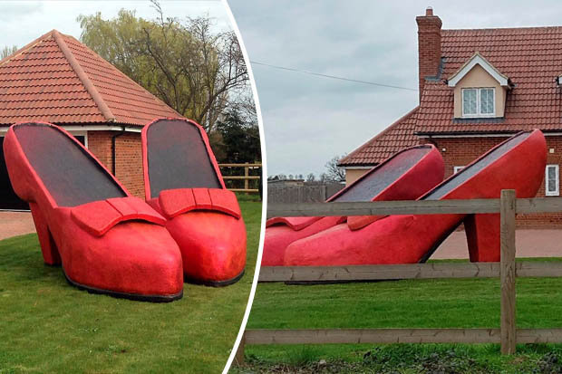SURPRISE: A husband shocks his wife's extreme obsession with shoes
Andy Walker, 50, installed two giant, 14ft tall ruby slippers in their front garden.

Mr Walker ordered the Wizard of Oz style shoes in response to wife Julie's obsession with footwear.

The scrap merchant said: "She's always asking for this pair and that pair and I just thought this might shut her up.