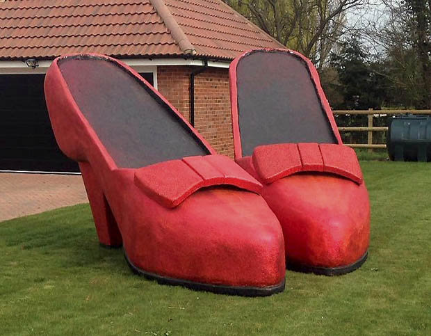 WOWZER: The two giant, 14ft tall ruby slippers were in the front garden

"We have a laugh with each other and I just thought how funny it would be. Like many others she's got this ridiculous obsession with shoes.

"I just got a phone call off her shouting 'what are these in my garden?'"

The killer heels sat proudly on his front lawn and attracted onlookers following the red brick road beside them.