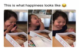 Wholesome meme of little girl that is very happy to get a whole box of donuts