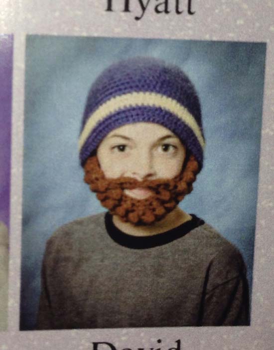 Funny picture of kid who wore fake beard and hat on picture day