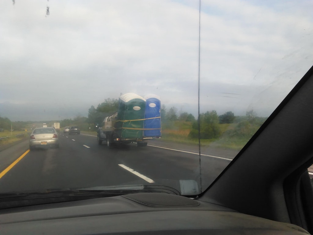 Truck on the highway with a load of porta potties