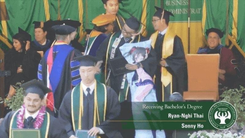 man graduating while hugging his Waifu
