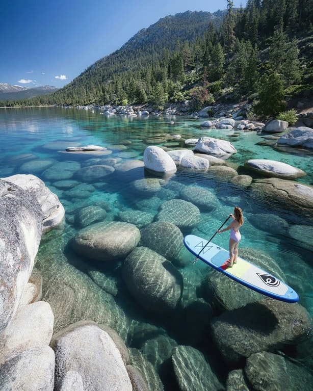 girl on paddle board near Lake Tahoe NV