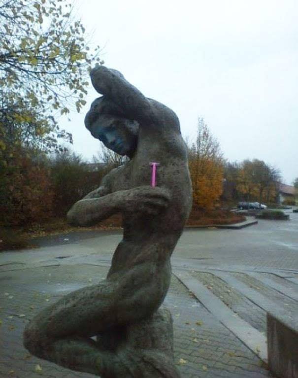 Godlike muscular statue with pink ladies shaver shaving his armpit