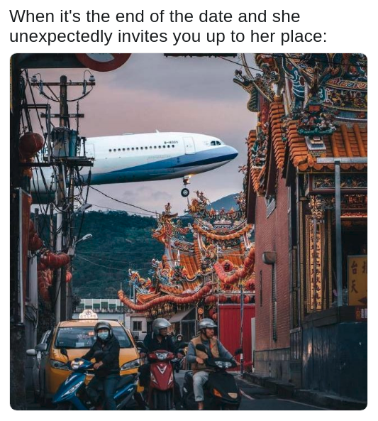 pic of a street in East Asia with an airplane taking off in the background