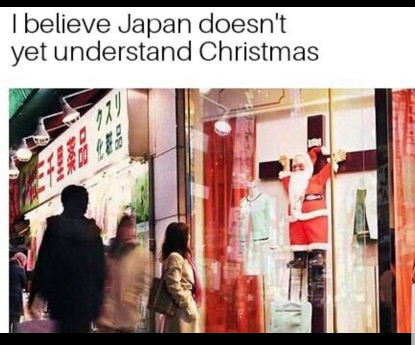 pic of Christmas decorations in Japan being a crucified Santa