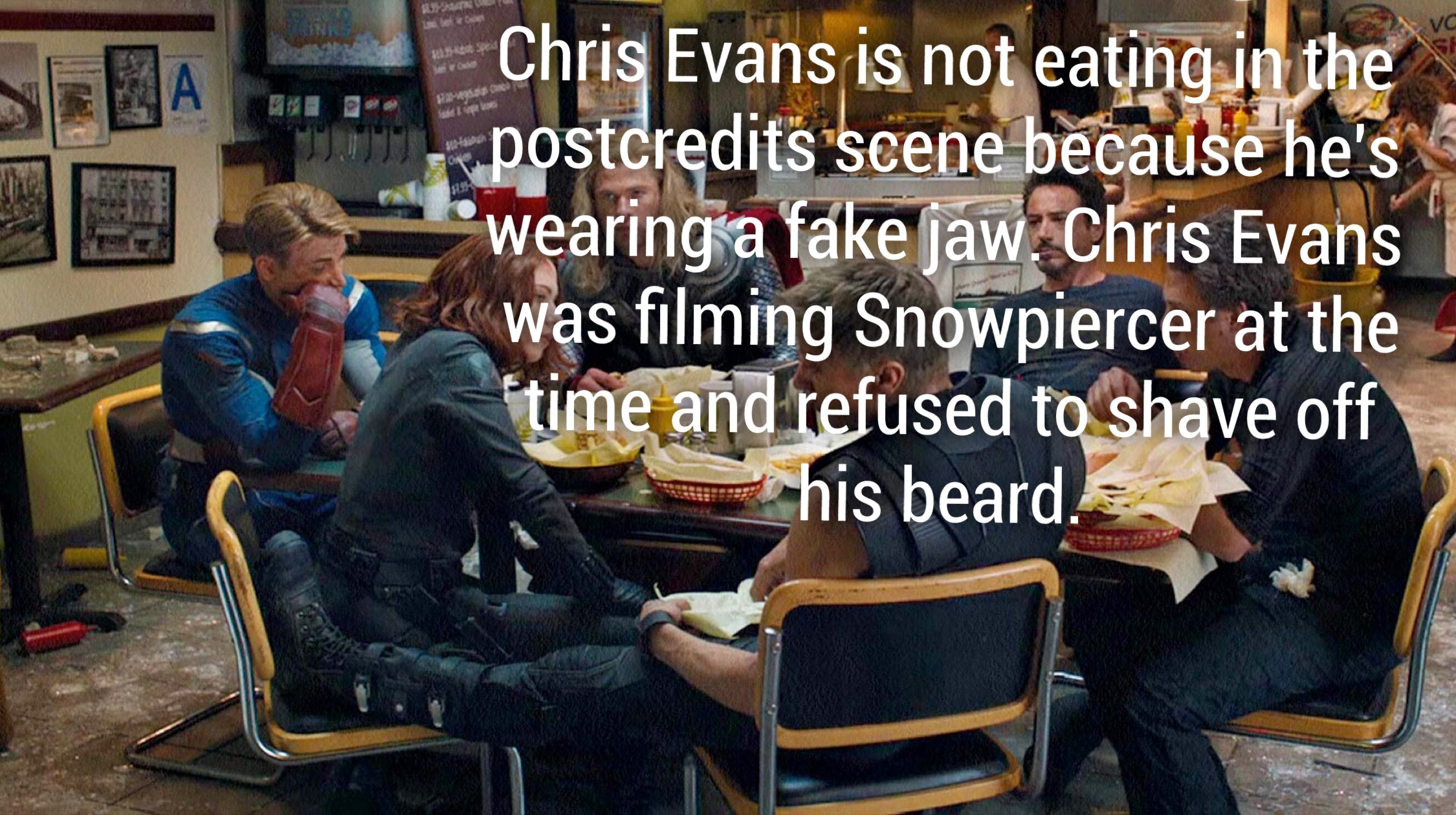 Chris Evans is not eating in the postcredits scene because he's "wearing a fake jaw. Chris Evans was filming Snowpiercer at the time and refused to shave off T his beard.