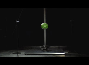 slow motion of water melon being saved by an airbag