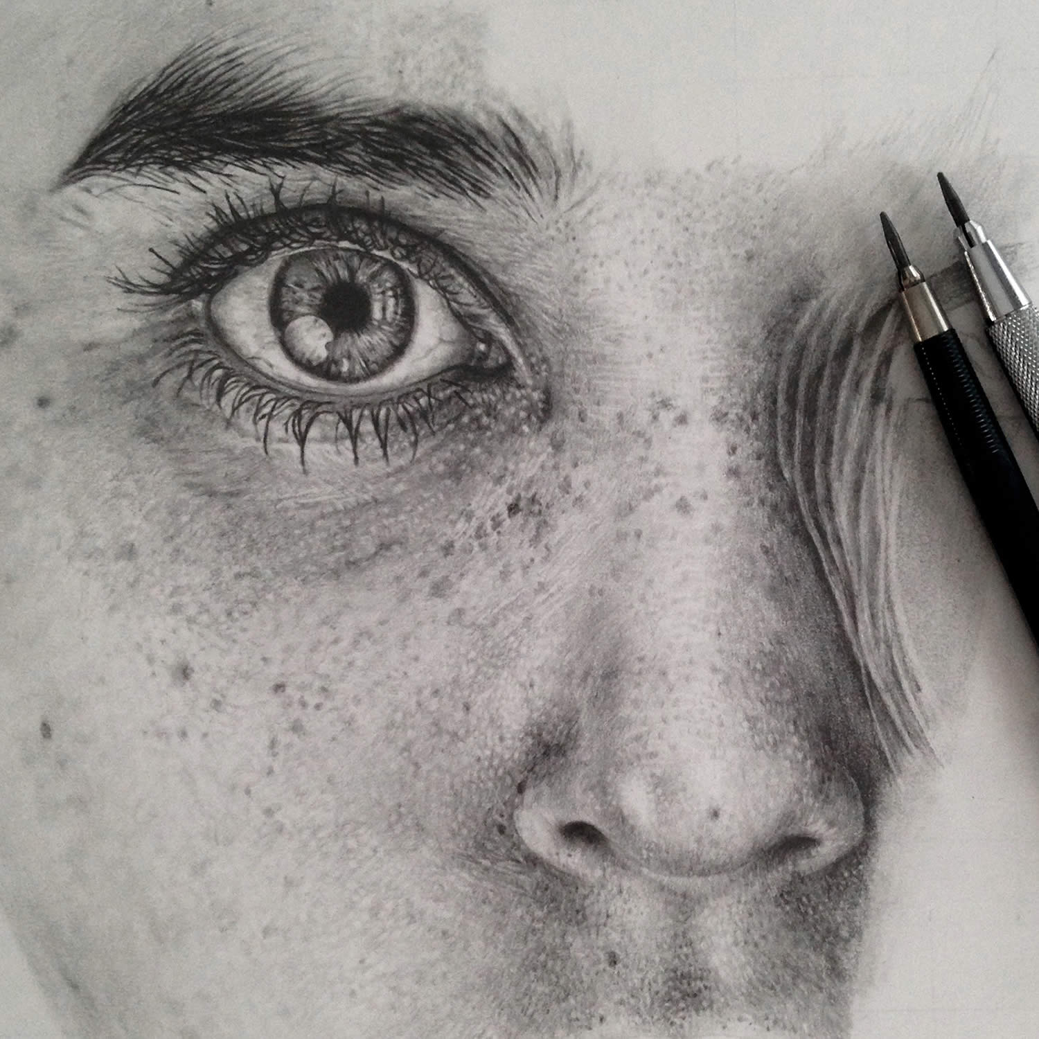 Hyper-realistic drawing of a woman's face.