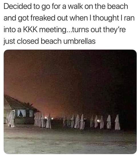 kkk beach umbrellas - Decided to go for a walk on the beach and got freaked out when I thought Iran into a Kkk meeting...turns out they're just closed beach umbrellas