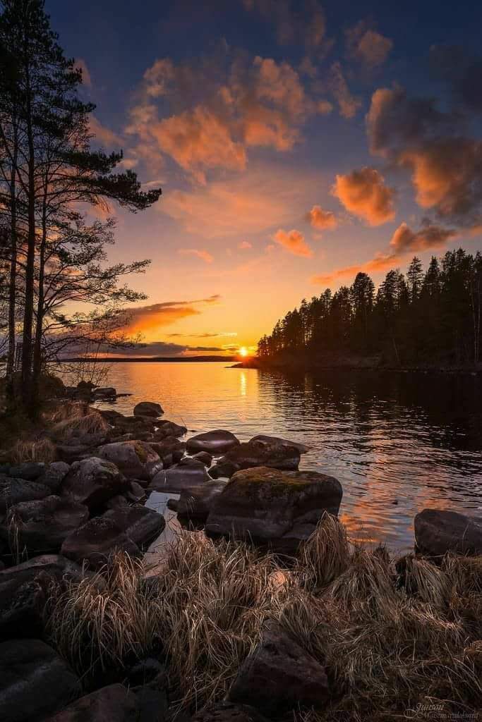 beautiful photo of sunset by water