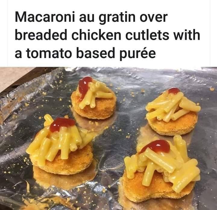 Food - Macaroni au gratin over breaded chicken cutlets with a tomato based pure