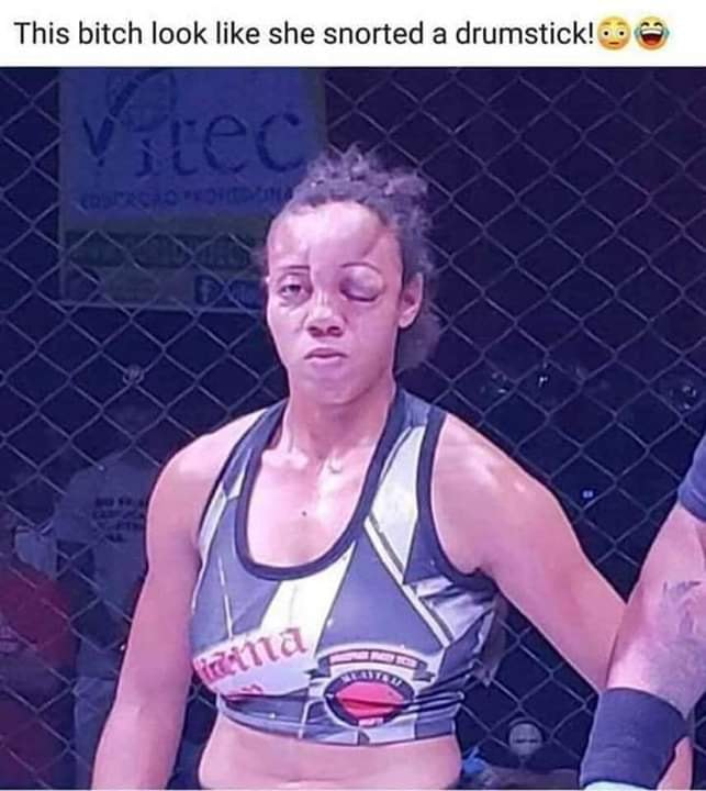 woman mma fighter looks like she snorted a drumstick - This bitch look she snorted a drumstick!