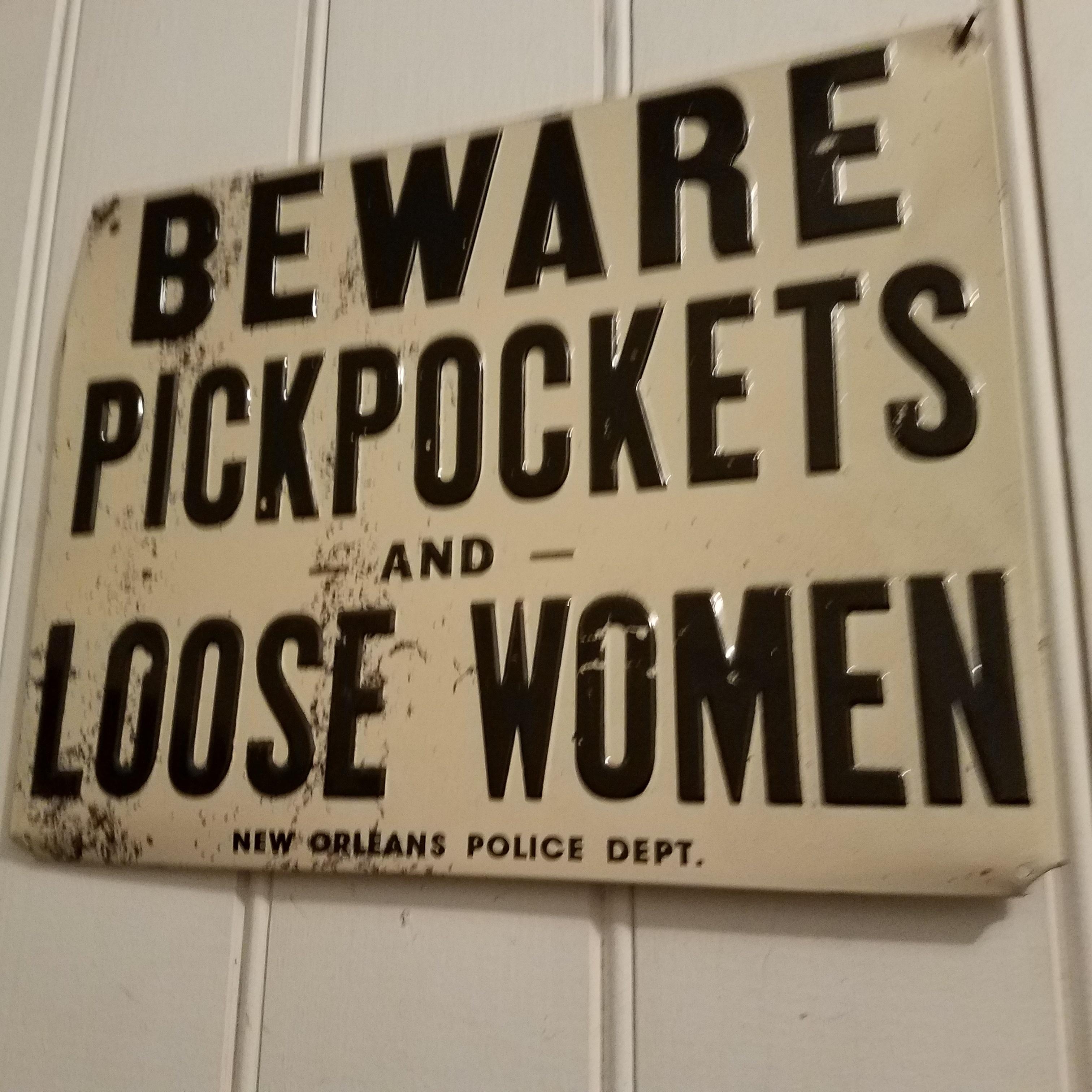street sign - "Beware Pckpockets And Loose Women New Orleans Police Dept.
