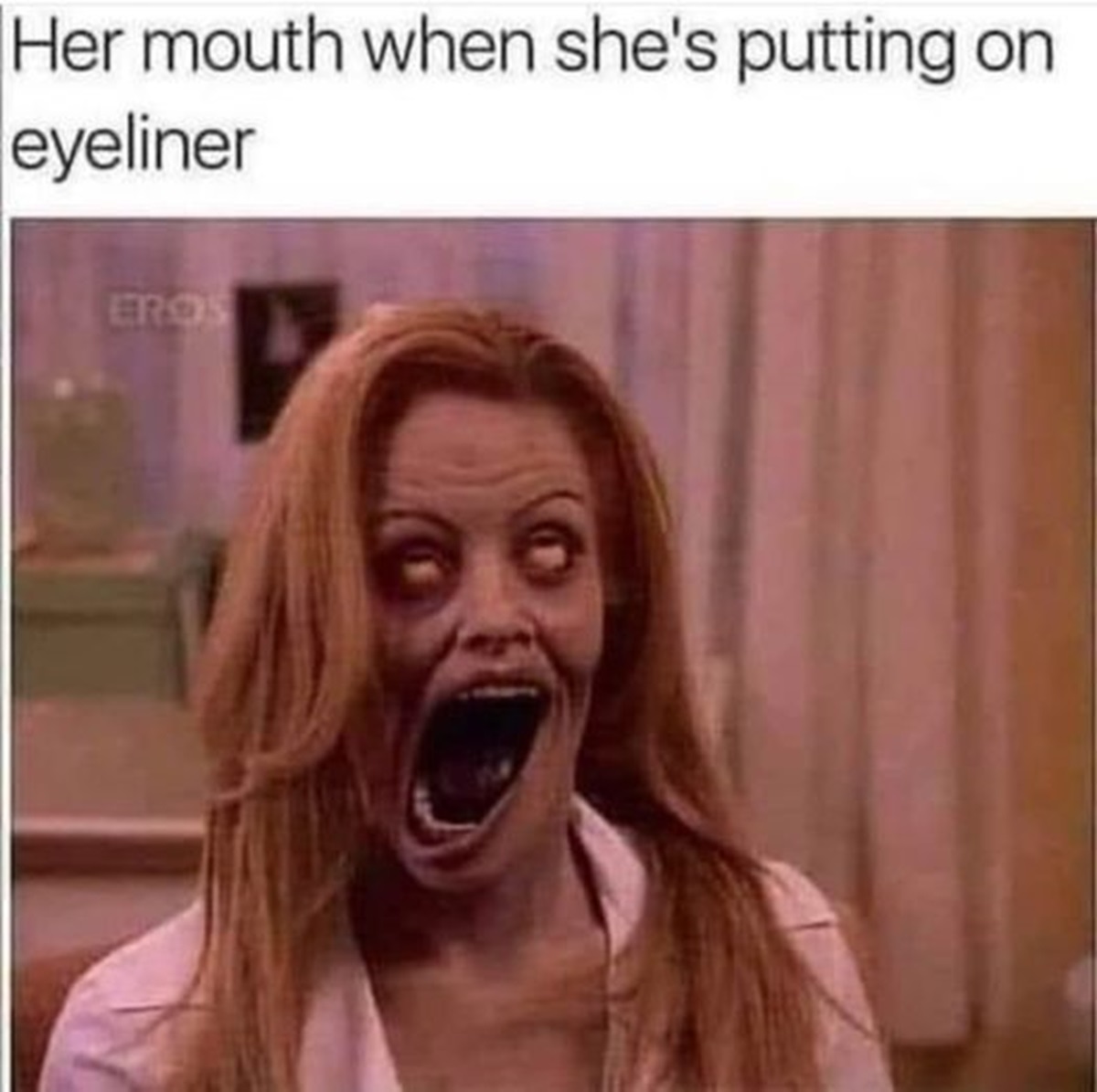 photo caption - Her mouth when she's putting on eyeliner Eros