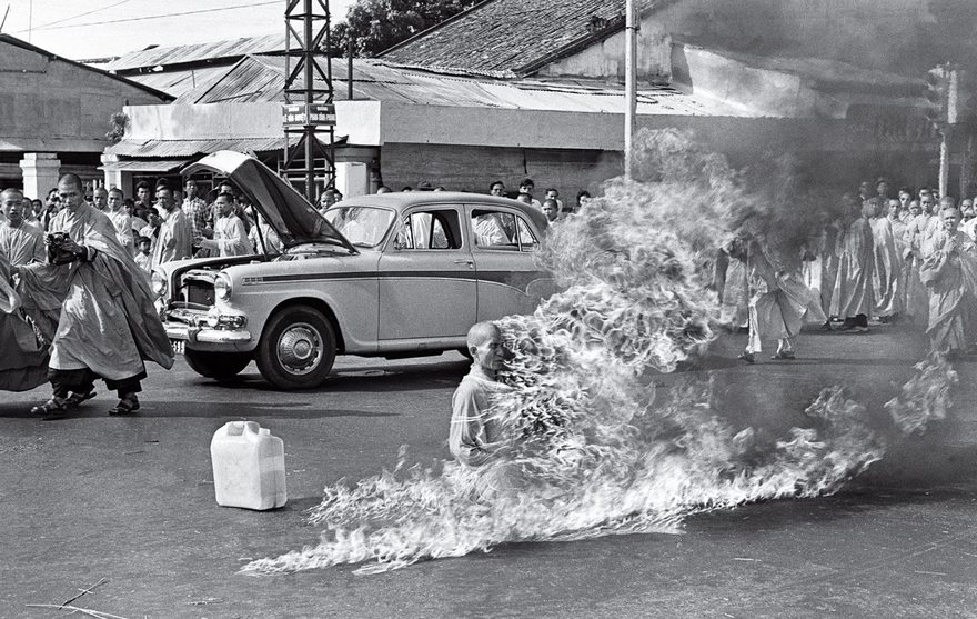 The Burning Monk, Malcolm Browne, 1963


In June 1963, most Americans couldn’t find Vietnam on a map. But there was no forgetting that war-torn Southeast Asian nation after Associated Press photographer Malcolm Browne captured the image of Thich Quang Duc immolating himself on a Saigon street. Browne had been given a heads-up that something was going to happen to protest the treatment of Buddhists by the regime of President Ngo Dinh Diem. Once there he watched as two monks doused the seated elderly man with gasoline. “I realized at that moment exactly what was happening, and began to take pictures a few seconds apart,” he wrote soon after. His Pulitzer Prize–­winning photo of the seemingly serene monk sitting lotus style as he is enveloped in flames became the first iconic image to emerge from a q5uagmire that would soon pull in America. Quang Duc’s act of martyrdom became a sign of the volatility of his nation, and President Kennedy later commented, “No news picture in history has generated so much emotion around the world as that one.” Browne’s photo forced people to question the U.S.’s association with ­Diem’s government, and soon resulted in the Administration’s decision not to interfere with a coup that November.