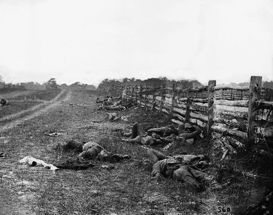 The Dead Of Antietam, Alexander Gardner, 1862.  It was at Antietam, the blood-churning battle in Sharpsburg, Md., where more Americans died in a single day than ever had before, that one Union soldier recalled how “the piles of dead ... were frightful.” The Scottish-born photographer Alexander Gardner arrived there two days after the September 17, 1862, slaughter. He set up his stereo wet-plate camera and started taking dozens of images of the body-strewn country­side, documenting fallen soldiers, burial crews and trench graves. Gardner worked for Mathew Brady, and when he returned to New York City his employer arranged an exhibition of the work. Visitors were greeted with a plain sign reading “The Dead of Antietam.” But what they saw was anything but simple. Genteel society came upon what are believed to be the first recorded images of war casualties. Gardner’s photographs are so sharp that people could make out ­faces. The death was unfiltered, and a war that had seemed remote suddenly became harrowingly immediate. Gardner helped make Americans realize the significance of the fratricide that by 1865 would take more than 600,000 lives. For in the hallowed fields fell not faceless strangers but sons, brothers, fathers, cousins and friends. And Gardner’s images of Antietam created a lasting legacy by establishing a painfully potent visual precedent for the way all wars have since been covered.