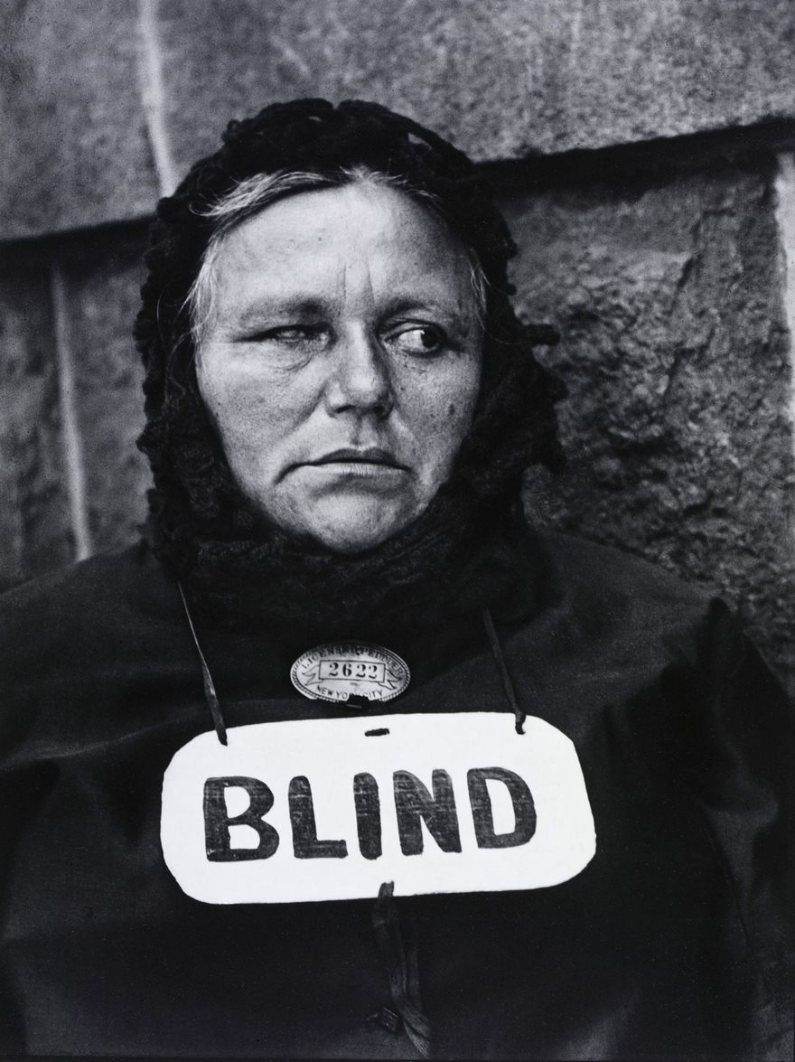 Blind, Paul Strand, 1916. Even if she could see, the woman in Paul Strand’s pioneering image might not have known she was being photographed. Strand wanted to capture people as they were, not as they projected themselves to be, and so when documenting immigrants on New York City’s Lower East Side, he used a false lens that allowed him to shoot in one direction even as his large camera was pointed in another. The result feels spontaneous and honest, a radical departure from the era’s formal portraits of people in stilted poses. Strand’s photograph of the blind woman, who he said was selling newspapers on the street, is candid, with the woman’s face turned away from the camera. But Strand’s work did more than offer an unflinching look at a moment when the nation was being reshaped by a surge of immigrants. By depicting subjects without their knowledge—or consent—and using their images to promote social awareness, Strand helped pave the way for an entirely new form of documentary art: street photography.