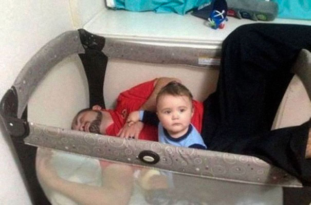 dad in crib with baby
