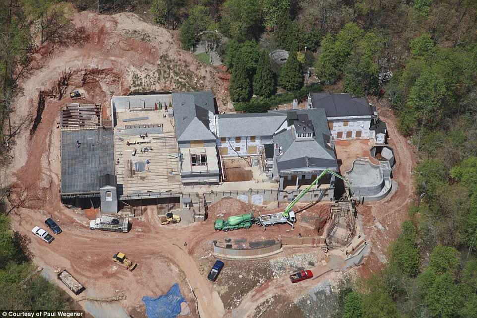 Bulletproof doors, self-sufficient bunker, and a 'Batcave' garage hidden behind a waterfall: This $14.7M mansion might be the safest house in the country