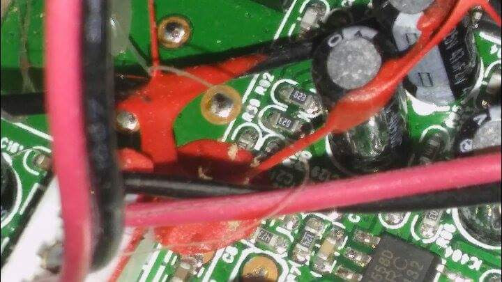 Unidentified red explosion attached to circuit board.